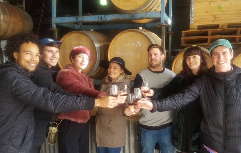 group with wine barrels